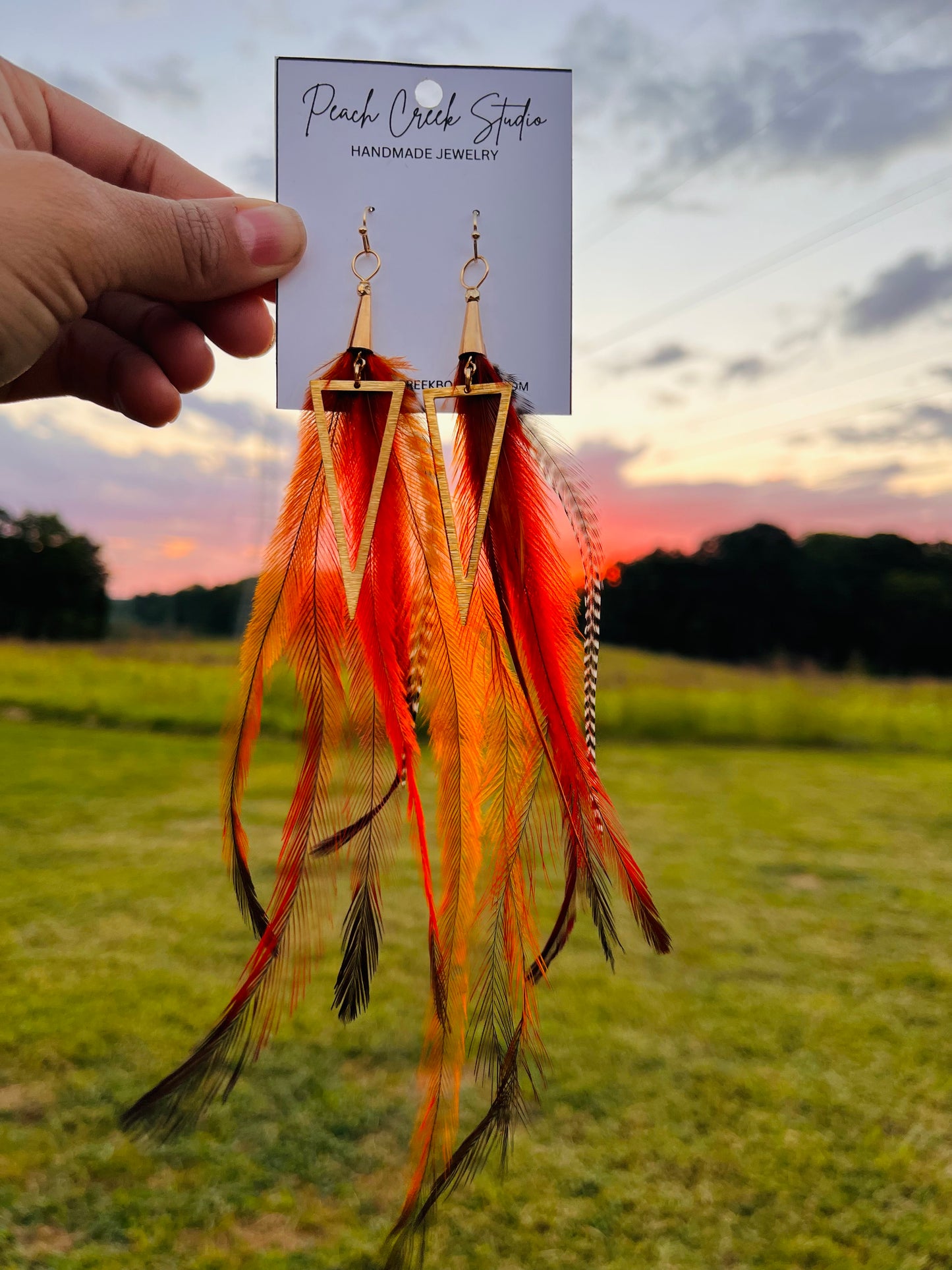 Sunset glow bright colorful handmade feather earring gold metal lightweight festival accessory